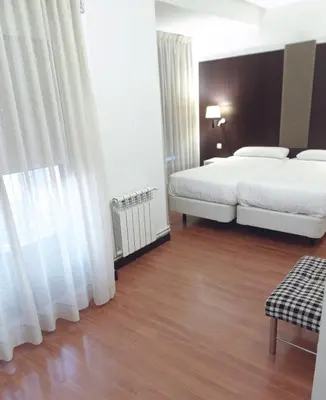 Cama o camas de una habitación en Hotel Delta
