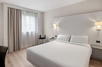 Cama o camas de una habitación en B&B HOTEL Ciudad de Lleida