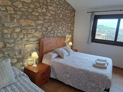 Cama o camas de una habitación en Casa Moliner