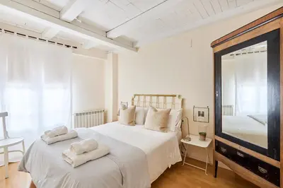 Cama o camas de una habitación en Centro historico,Atico con encanto con vistas a los Encierros de San Fermin
