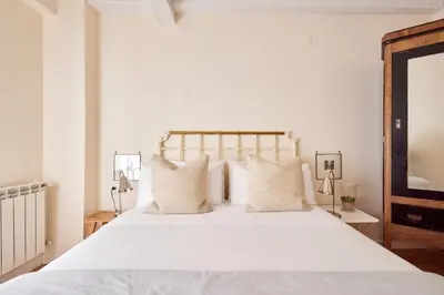 Cama o camas de una habitación en Centro historico,Atico con encanto con vistas a los Encierros de San Fermin