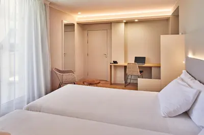 Cama o camas de una habitación en Silken Reino de Aragón