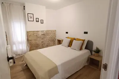 Cama o camas de una habitación en BOUTIQUE Apartment AVE Centro Lleida