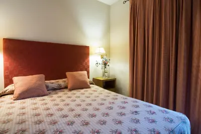 Cama o camas de una habitación en Apartaments Suites Sant Jordi