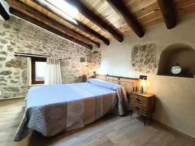 Cama o camas de una habitación en El Castellá