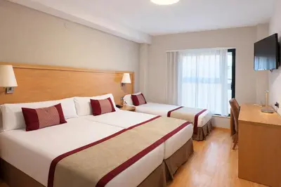 Cama o camas de una habitación en Hotel Real