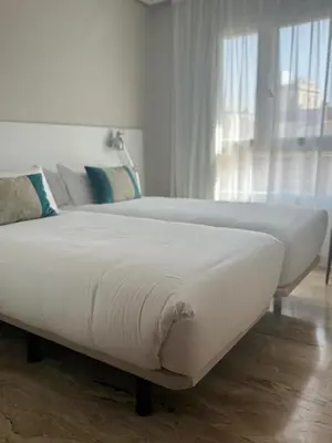 Cama o camas de una habitación en Aparthotel Los Girasoles
