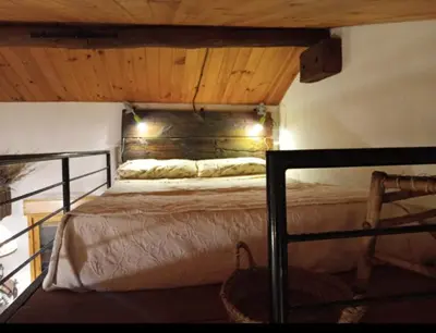 Cama o camas de una habitación en LES LLÚDRIGUES Casa Loft con aire ac y terraza