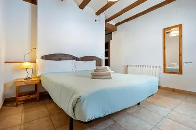 Cama o camas de una habitación en Cal Tous, La Socarrimada