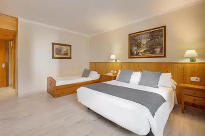 Cama o camas de una habitación en Hotel Nievesol