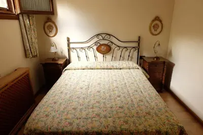 Cama o camas de una habitación en Casa rústica familiar en los Pirineos