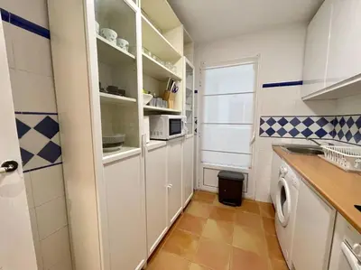 Una cocina o zona de cocina en Acogedor apartamento en Zaragoza