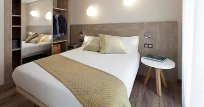 Cama o camas de una habitación en Hotel Dos Rios Central