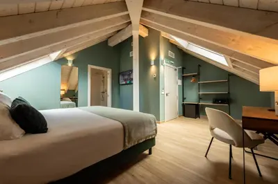 Cama o camas de una habitación en Silken Puerta de Irati
