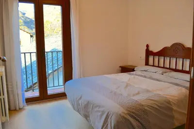 Cama o camas de una habitación en Apartament comfortable amb vistes i cèntric by RURAL D'ÀNEU