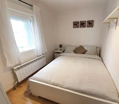 Cama o camas de una habitación en Acogedor piso en el centro de Sabiñanigo