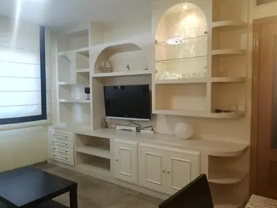Una televisión o centro de entretenimiento en Apartamento Escultor Moreto - PARKING GRATIS