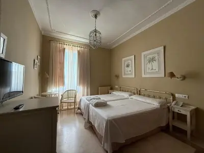 Cama o camas de una habitación en Hotel Parque Balneario Termas Pallares