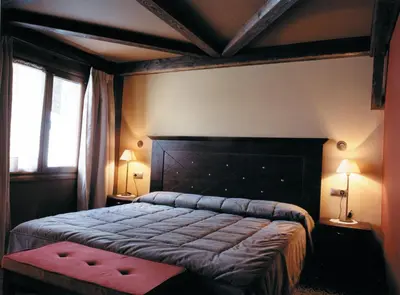 Cama o camas de una habitación en Hotel Hospital de Benasque