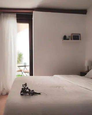 Cama o camas de una habitación en Apartamentos Abadía.