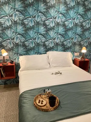 Cama o camas de una habitación en Apartamentos Abadía.