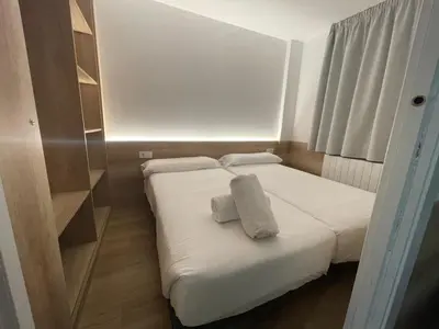 Cama o camas de una habitación en Apartamentos La Solana