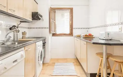 Una cocina o zona de cocina en Ático A Residencial Caldares El Pueyo