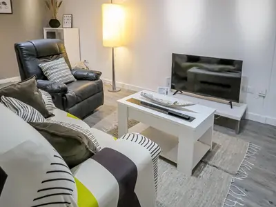 Una televisión o centro de entretenimiento en Gran piso pleno centro. Plaza del Pilar + Desayuno