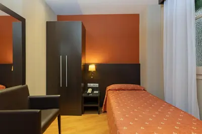 Cama o camas de una habitación en Hotel Casanova