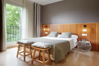 Cama o camas de una habitación en Hotel Iriguibel Huarte Pamplona