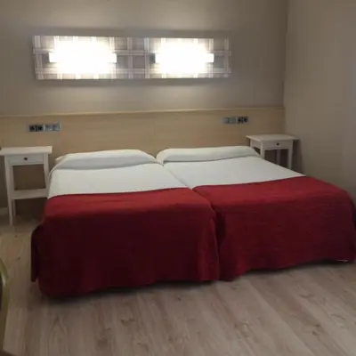Cama o camas de una habitación en Hotel Alaiz