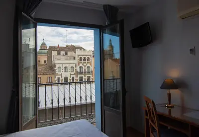 Cama o camas de una habitación en Hotel Hispania