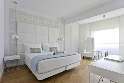 Cama o camas de una habitación en Hotel Tres Reyes Pamplona