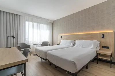 Cama o camas de una habitación en Hotel Blanca de Navarra