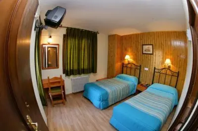 Cama o camas de una habitación en Hotel Llibrada