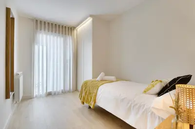 Cama o camas de una habitación en Apartamentos La muralla de Jaca