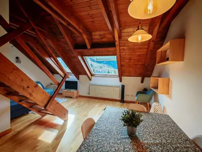 Zona de estar de Tu dúplex luminoso con vistas y confort - Erta 12