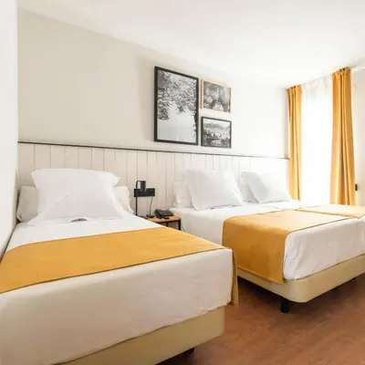 Cama o camas de una habitación en Hotel Viella