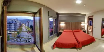 Cama o camas de una habitación en Hotel Avenida