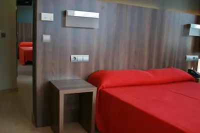 Cama o camas de una habitación en Hotel Avenida