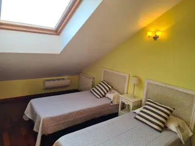 Cama o camas de una habitación en El ático de la Gorga
