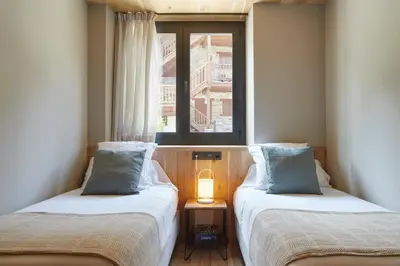 Cama o camas de una habitación en Nheu d'Arties by FeelFree Rentals