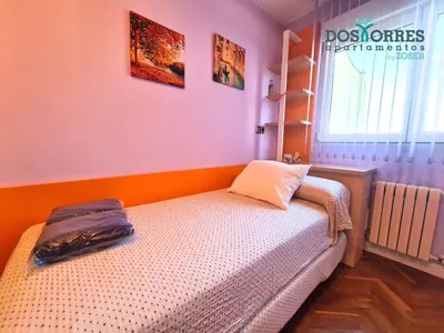 Cama o camas de una habitación en Dos Torres Conde Aranda - Céntrico con estacionamiento Incluido