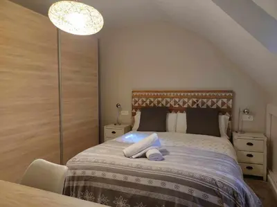 Cama o camas de una habitación en El Cambaz - tucasaenlospirineos