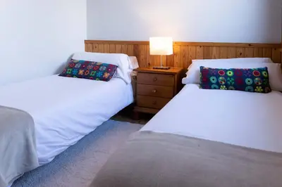 Cama o camas de una habitación en Tebarray ☆ Increíbles vistas, terraza y garaje · Pirineos360