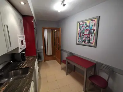 Una cocina o zona de cocina en Cómoda vivienda en Huesca