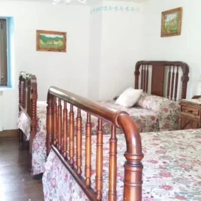 Cama o camas de una habitación en Casa Rural Barangua en el Pirineo Aragonés