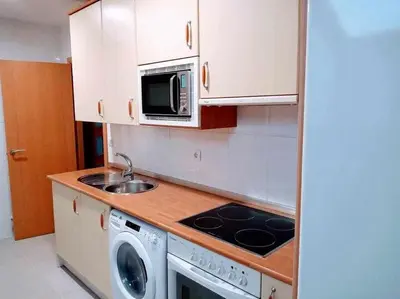 Una cocina o zona de cocina en Precioso atico con bonitas vistas a la Peña Oroel