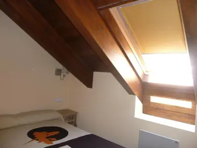 Cama o camas de una habitación en La buhardilla de Mayte
