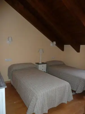 Cama o camas de una habitación en La buhardilla de Mayte